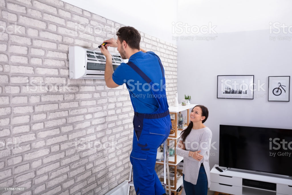 12,631 Air Conditioner Repair Stock Photos, Pictures &amp; Royalty-Free Images - iStock